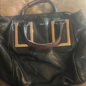 Chloé Black Leather Handbag with Gold Accents